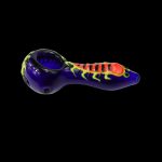 Glass pipe with a vibrant spider design, isolated on a black background.