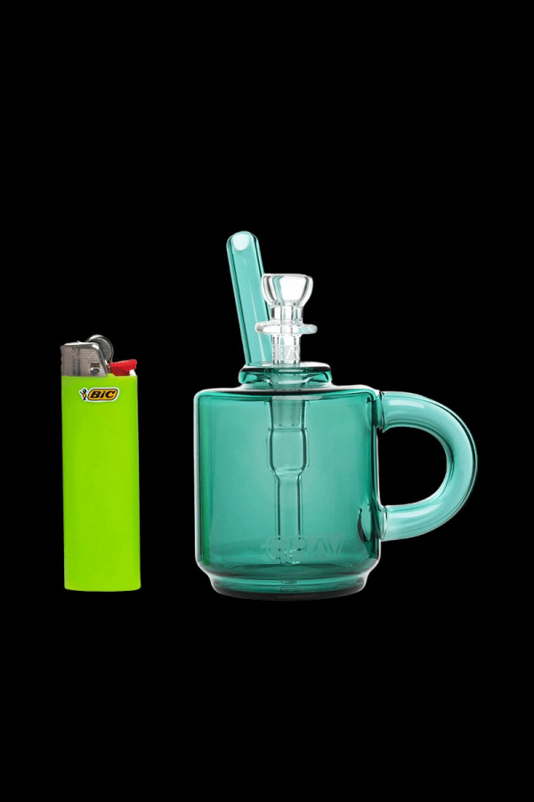 Green glass bubbler with a lighter beside it.