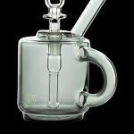 Green glass rig with a handle and mouthpiece, designed for concentrated cannabis use.