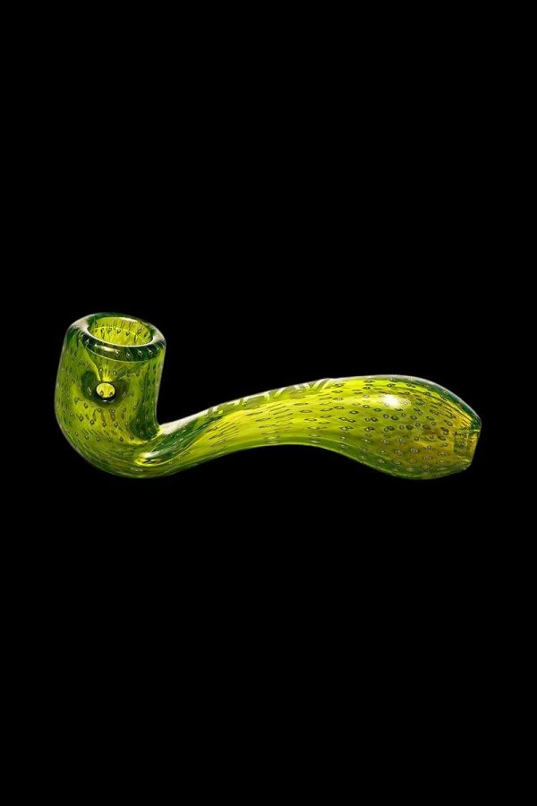 Green glass pipe isolated on a black background.
