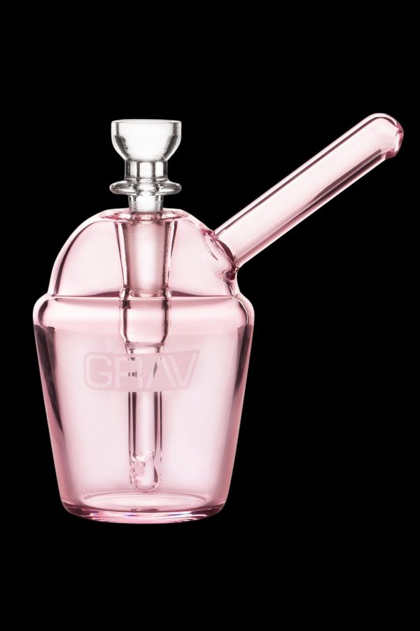 Pink glass bubbler with a cylindrical mouthpiece and intricate internal diffusion.
