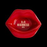Red, glossy lips shaped as an ashtray with “Her Highness NYC” text inside, against a black background.