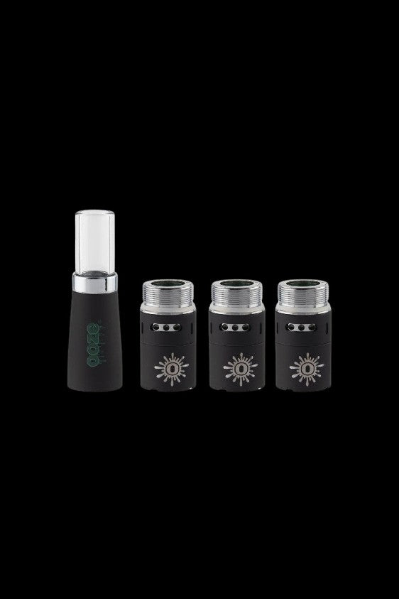 Black cannabis oil cartridges and a charging base on a dark background.