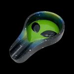 Alien-shaped ashtray with a speckled galaxy design, isolated on a black background.