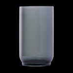 Frosted glass smoking pipe against a black background.