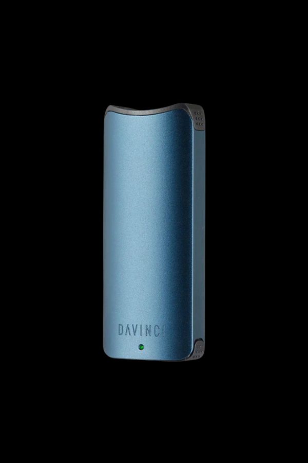 Blue DaVinci IQ2 vaporizer against a black background.