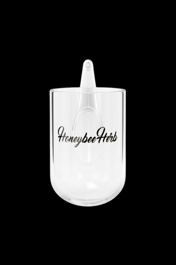 Clear glass Honeybee Herb oil rig with a rounded base and mouthpiece.