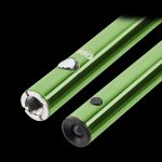 Two green cannabis vape pen batteries lie diagonally against a black background.