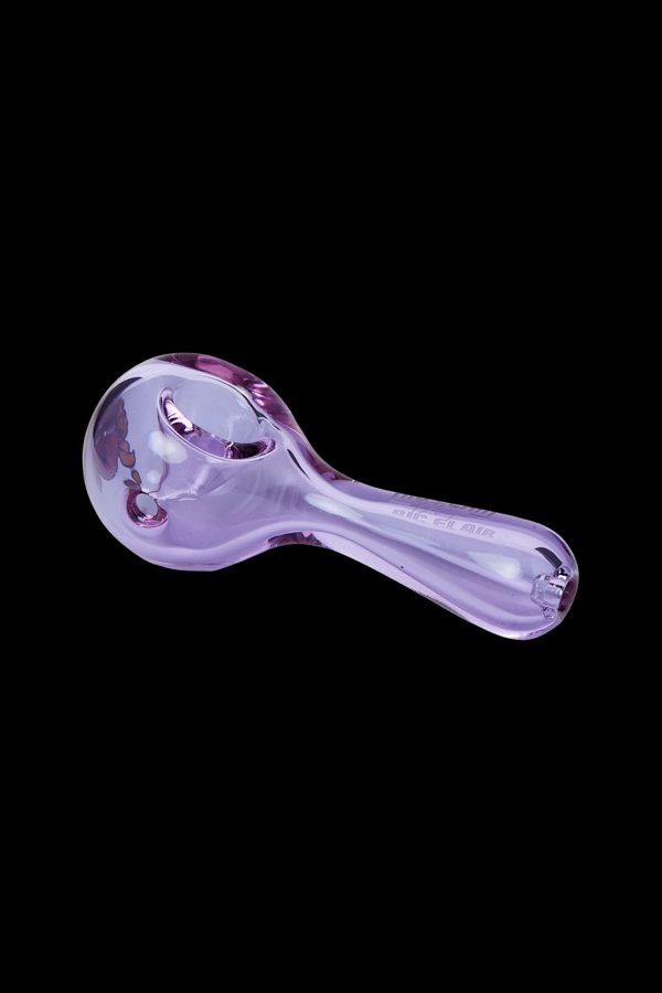 Purple glass smoking pipe against a black background.