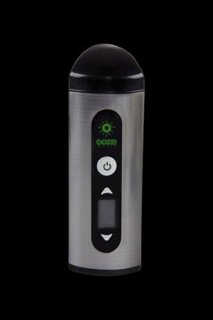 Silver cannabis vaporizer with digital display and controls against a black background.