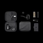 Puffco Peak Pro portable vaporizer kit displayed open in a carrying case, including device, accessories, and charging cable.