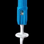 Blue and white cannabis dab tool isolated on a black background.