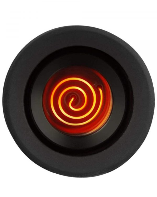 Close-up of a glowing coil inside a dark cannabis vaporizer.