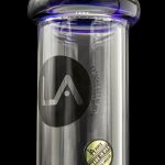 A clear glass water pipe with blue accents, featuring a black "LA" logo and "LA PIPES MADE IN USA LOS ANGELES" text.