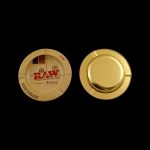 Gold rolling paper container with RAW branding.