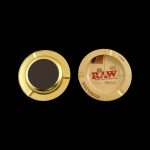 Gold metal grinder with a RAW rolling papers design.