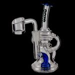 Clear glass dab rig with blue accents and a quartz banger.