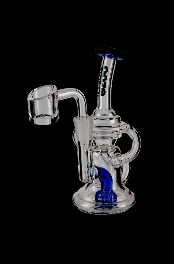 Clear glass dab rig with blue accents and a quartz banger.