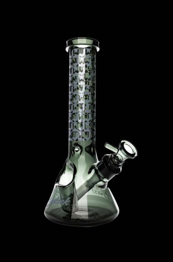 Green glass water pipe with geometric pattern.