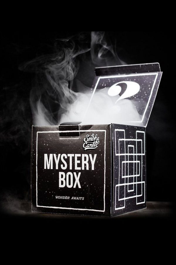 Open black box labeled “Mystery Box” with smoke rising from within, suggesting cannabis accessories inside.