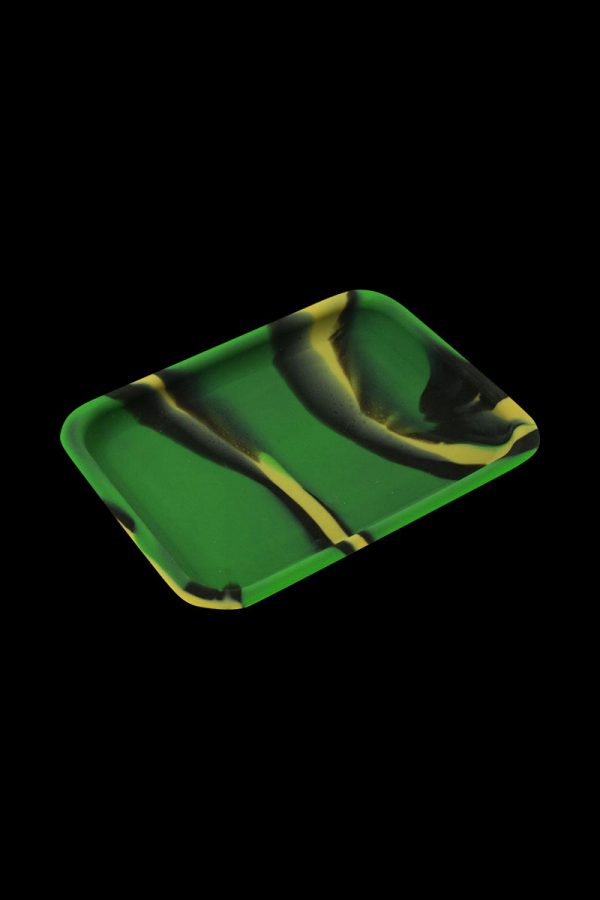The Silicone Concentrate Tray is shown from above, a dark-colored dish with a subtle, glossy sheen.