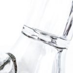 A close-up, angled view of the Tank Glass "The Original" Tank Beaker, showcasing its clear glass construction.