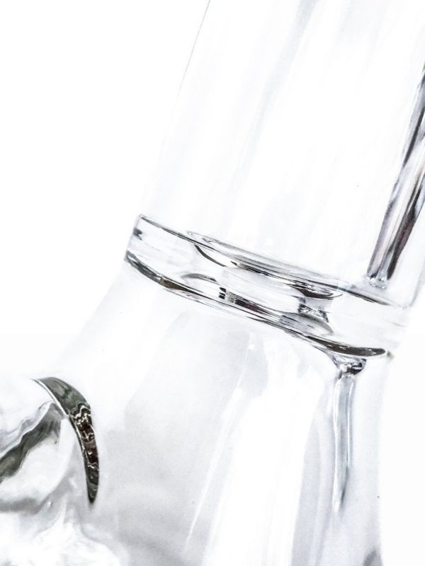 A close-up, angled view of the Tank Glass "The Original" Tank Beaker, showcasing its clear glass construction.