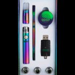Colorful cannabis vape pen kit with cartridges and charger in a gift box.
