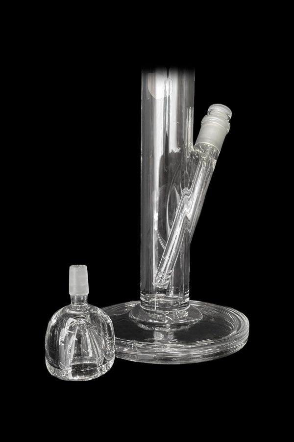 Clear glass bong and attachment on a black background.