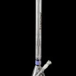 Clear glass bong with blue accents and intricate percolators, isolated on a black background.