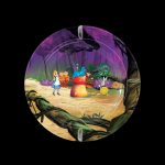 A circular glass plate depicting a whimsical “Alice in Wonderland” scene with cannabis-themed characters and foliage, likely a smoking accessory.