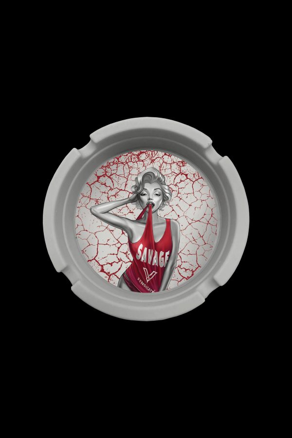 Round ashtray with cracked red design featuring a pin-up girl wearing a "Savage" jersey.