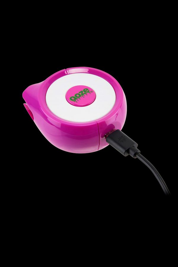 Pink electronic vaporizer with charging cable.
