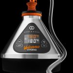 Front view of the Storz & Bickel Volcano Hybrid Desktop Vaporizer displaying a digital temperature readout on its sleek, dark gray body.
