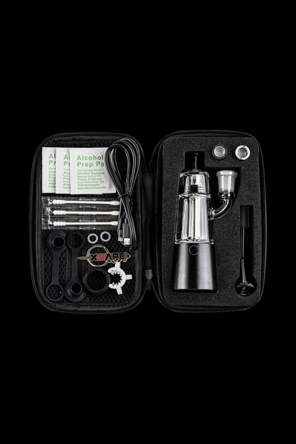 The XVAPE Vista Mini 2 Electronic Dab Rig is displayed open within its carrying case, revealing its components and a small alcohol prep pad.
