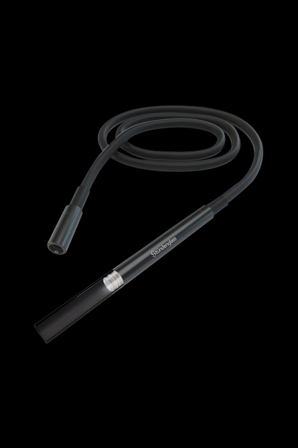 Clear glass cannabis oil rig with coiled tubing against a black background.