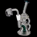 Clear glass dab rig with green accents and a quartz banger, isolated on a black background.